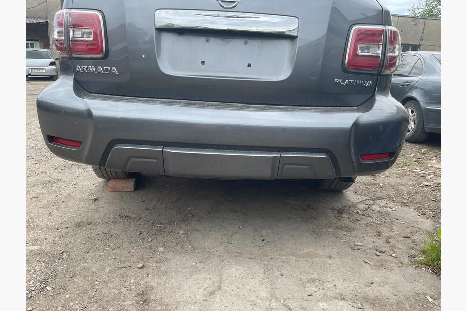 Nissan Armada 2016-2024 гг. Задний бампер в сборе (Оригинал 2019) Image