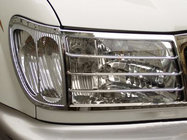 Toyota Land Cruiser 100 1998-2007 гг. Накладки на фары V2 (2 шт., пластик) фото 1