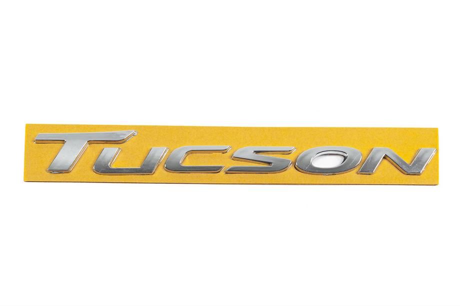 Hyundai Tucson TL 2016-2021 гг. Надпись Tucson 86310D300 (220мм x 22мм) Image