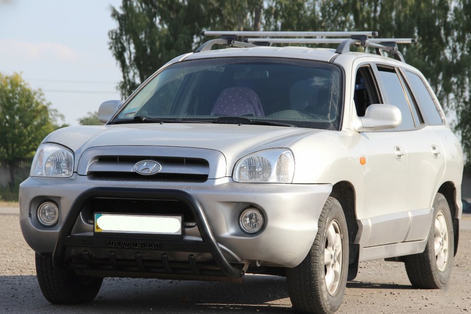 Hyundai Santa Fe 1 2000-2006 гг. Кенгурятник WT004 Черный (Нержавейка) Фото 1