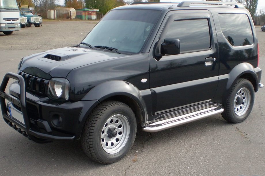 Suzuki Jimny 1998-2018 гг. Кенгурятник QT007-Exclusive Black (с надписью, нерж.) Фото 7