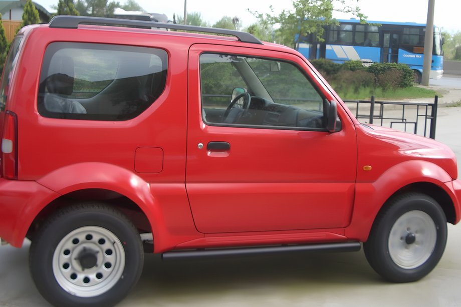 Suzuki Jimny 1998-2018 гг. Боковые трубы Black (2 шт., нержавейка) Image