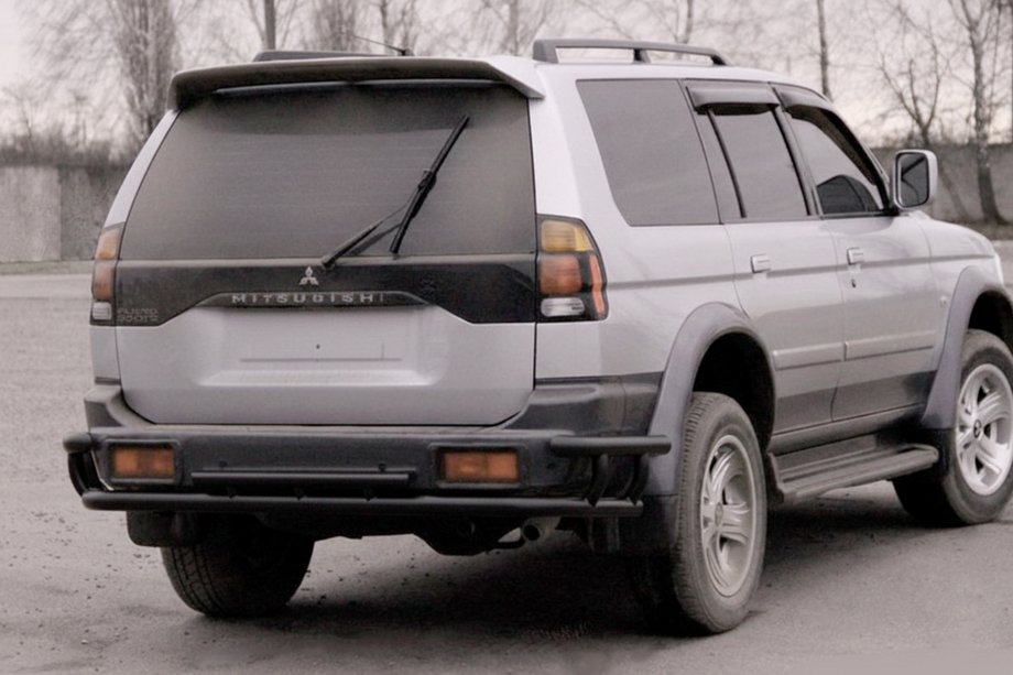 Mitsubishi Pajero Sport 1996-2007 гг. Задняя защита AK005-2 Черный (нерж. сталь) Фото 1