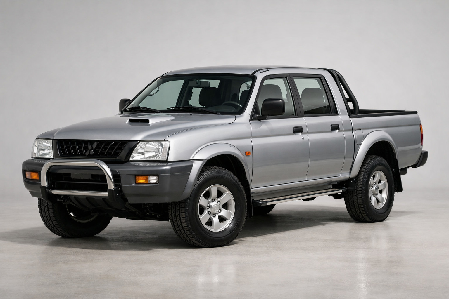 Обзор Mitsubishi L200 1996–2006: олдскульный пикап без глянца