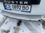 Dacia Duster 2008-2018 гг. Накладка на задний бампер Carmos V1 с загибом (нержавейка) фото 2