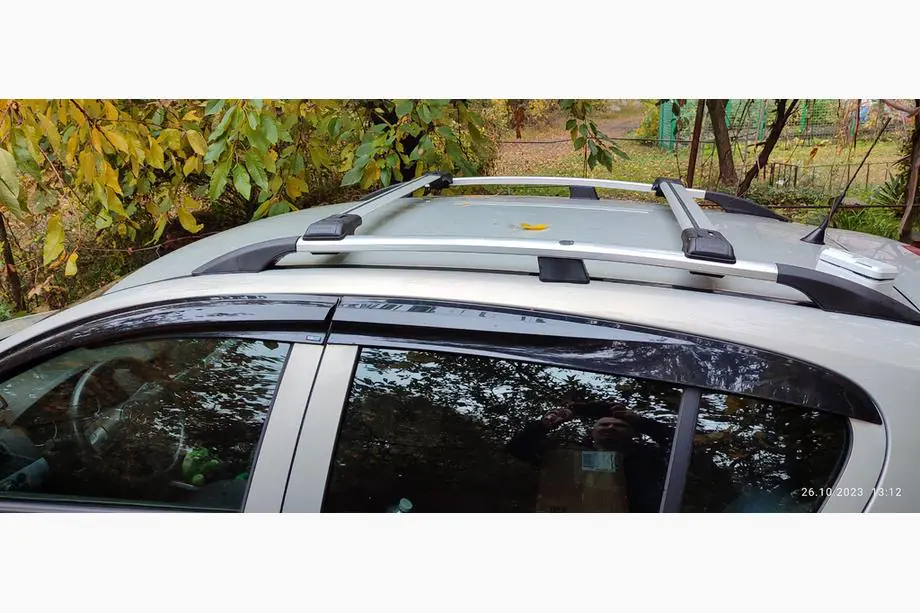 Opel Astra H 2004-2013 гг. Поперечные дуги на стандартные рейлинги с замком (2 шт) Фото 1