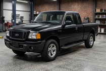 Ford Ranger 2002-2006 гг. Боковые Подножки Tayga Black (2 шт., Алюминий) фото 1